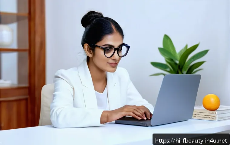 디지털 피부 건강 관리 - A modern Indian woman in her late 20s sitting at a desk with a laptop and smartphone, wearing stylis...
